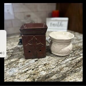 Two scent warmers. One is Scentsy brand. Other is from Walmart.